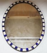 An oval Irish-style wall mirror, 56x41cm