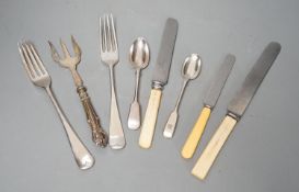A large quantity of assorted plated cutlery, including fish knives and forks and servers and three