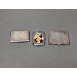 A silver cigarette case, an Austro Hungarian white metal box and a silver cigarette case with