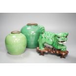 A 19th century Chinese green glazed model of a lion-dog, and two green crackle glaze jars, tallest