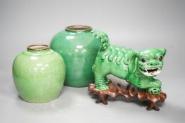 A 19th century Chinese green glazed model of a lion-dog, and two green crackle glaze jars, tallest