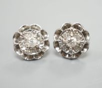 A pair of 750 white metal and five stone diamond cluster set earrings, 10mm, gross weight 3.2