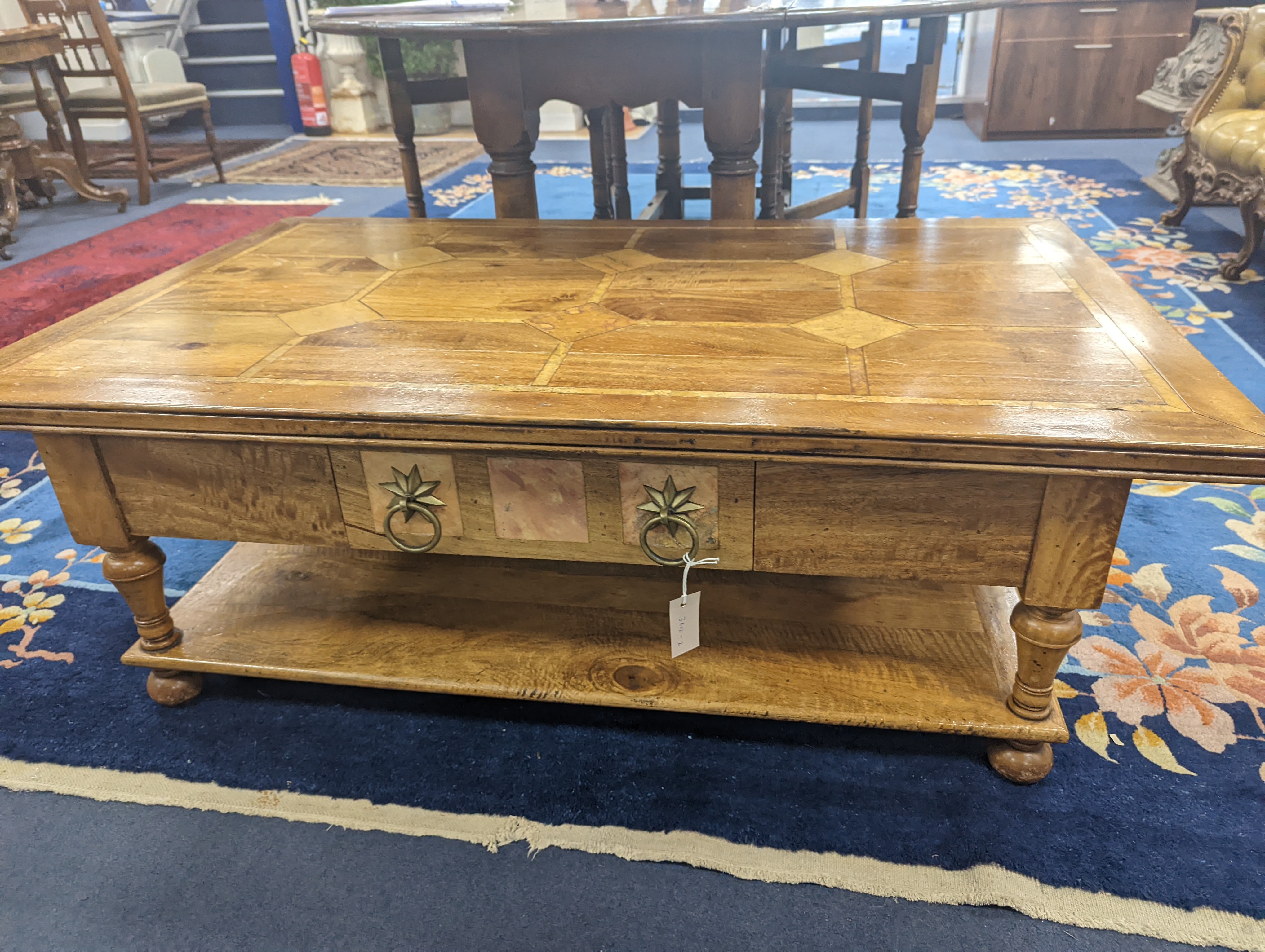 A hardwood and marble inset coffee table, length 130cm, depth 80cm, height 45cm - Image 6 of 7