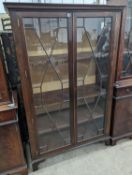 A reproduction George III style glazed mahogany two door display cabinet, width 108cm, depth 40cm,