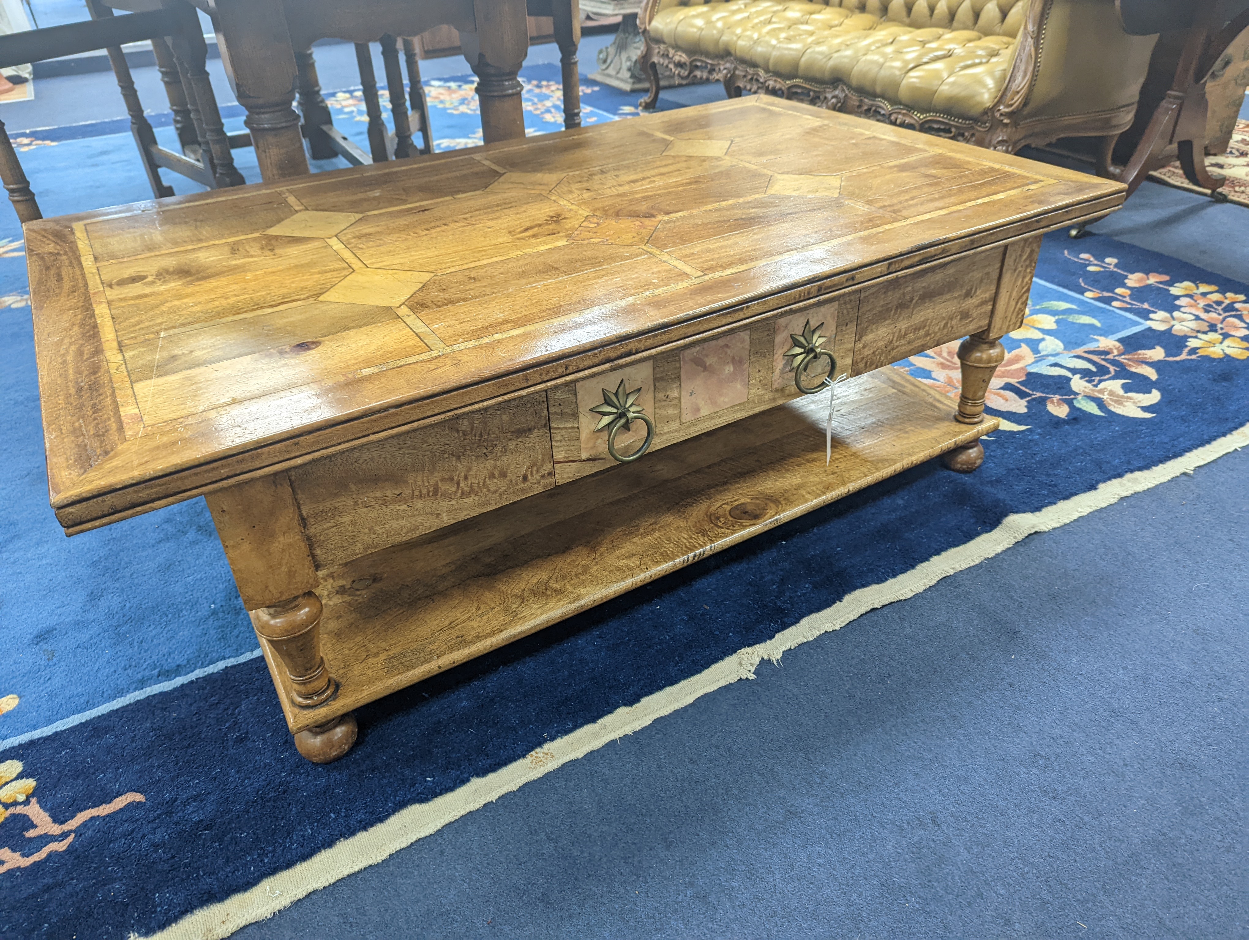 A hardwood and marble inset coffee table, length 130cm, depth 80cm, height 45cm