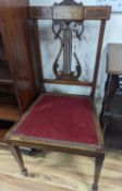 A pair of Edwardian inlaid mahogany lyre back chairs