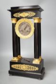 A 19th century ebonised portico mantel clock with brass mounts,46cms high.