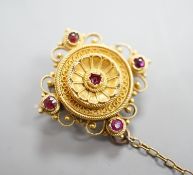 A Victorian cannettile work yellow metal and five stone ruby? chip set brooch, with safety chain,