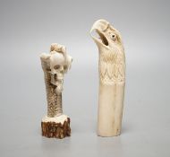 Two Japanese stag horn handles - eagle's head and a memento mori, eagle-head 13.5 cms high.