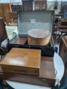A vintage iron bound wooden travelling trunk, a suitcase, hat box, an artist travel case, and