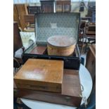 A vintage iron bound wooden travelling trunk, a suitcase, hat box, an artist travel case, and