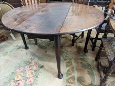 A George III mahogany oval pad foot drop leaf dining table, width 118cm, length 130cm extended,