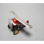 A Czech tinplate and clockwork model plane, wingspan 13 cms.