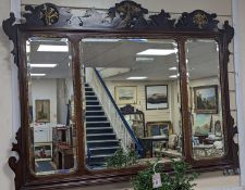 An Edwardian George III style mahogany fret cut triple plate overmantel mirror, width 116cm,