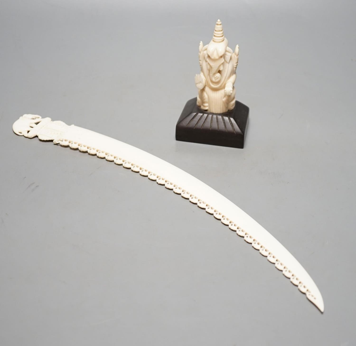 An Indian ivory letter opener, 38cm, and a Ganesh figure