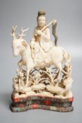 A Chinese carved ivory figure of a female immortal riding a deer, early 20th century, height 17cm