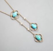 An Edwardian 9ct , three stone turquoise and four stone seed pearl set graduated double drop pendant