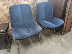 A pair of mid century blue fabric dining chairs