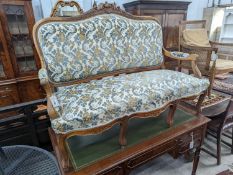A Louis XVI style carved walnut settee (wormed), length 140cm, depth 58cm, height 104cm
