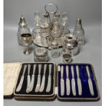 A plated cruet stand, two cased sets of silver handled tea knives, a silver domed ashtray(a.f.)