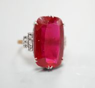 A yellow metal and large synthetic ruby set dress ring, with rose cut diamond set stepped shoulders,