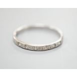 An 18k white metal and diamond chip set half eternity ring, size M/N, gross weight 1.5 grams.