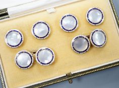 A cased 9ct, mother of pearl and enamel set six piece dress stud set, gross set 10.3 grams