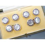 A cased 9ct, mother of pearl and enamel set six piece dress stud set, gross set 10.3 grams