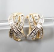 A modern pair of 14k, round and baguette cut diamond set triple row crossover earrings,15mm, gross