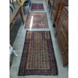 A Belouch geometric prayer rug and two Caucasian design rugs, largest 152 x 104cm