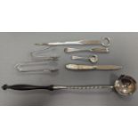 A George VI silver paper knife, London, 1937, a plated toddy ladle, two pairs of silver sugar tongs,