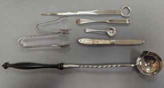 A George VI silver paper knife, London, 1937, a plated toddy ladle, two pairs of silver sugar tongs,
