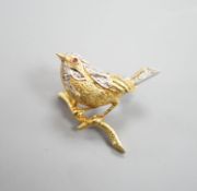 A modern textured 18ct two colour gold, ruby and diamond set bird brooch, 24mm, gross weight 6