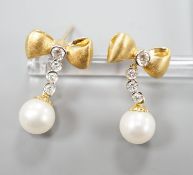 A modern pair of 750 yellow metal, cultured pearl and diamond set ribbon bow drop earrings,22mm,