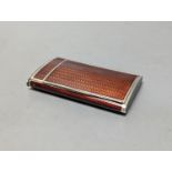 A 20th century Austro-Hungarian white metal and brown guilloche enamelled cigarette case, with match
