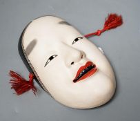 A Japanese pottery Okame noh mask, early 20th century, signed,19.5 cms high.