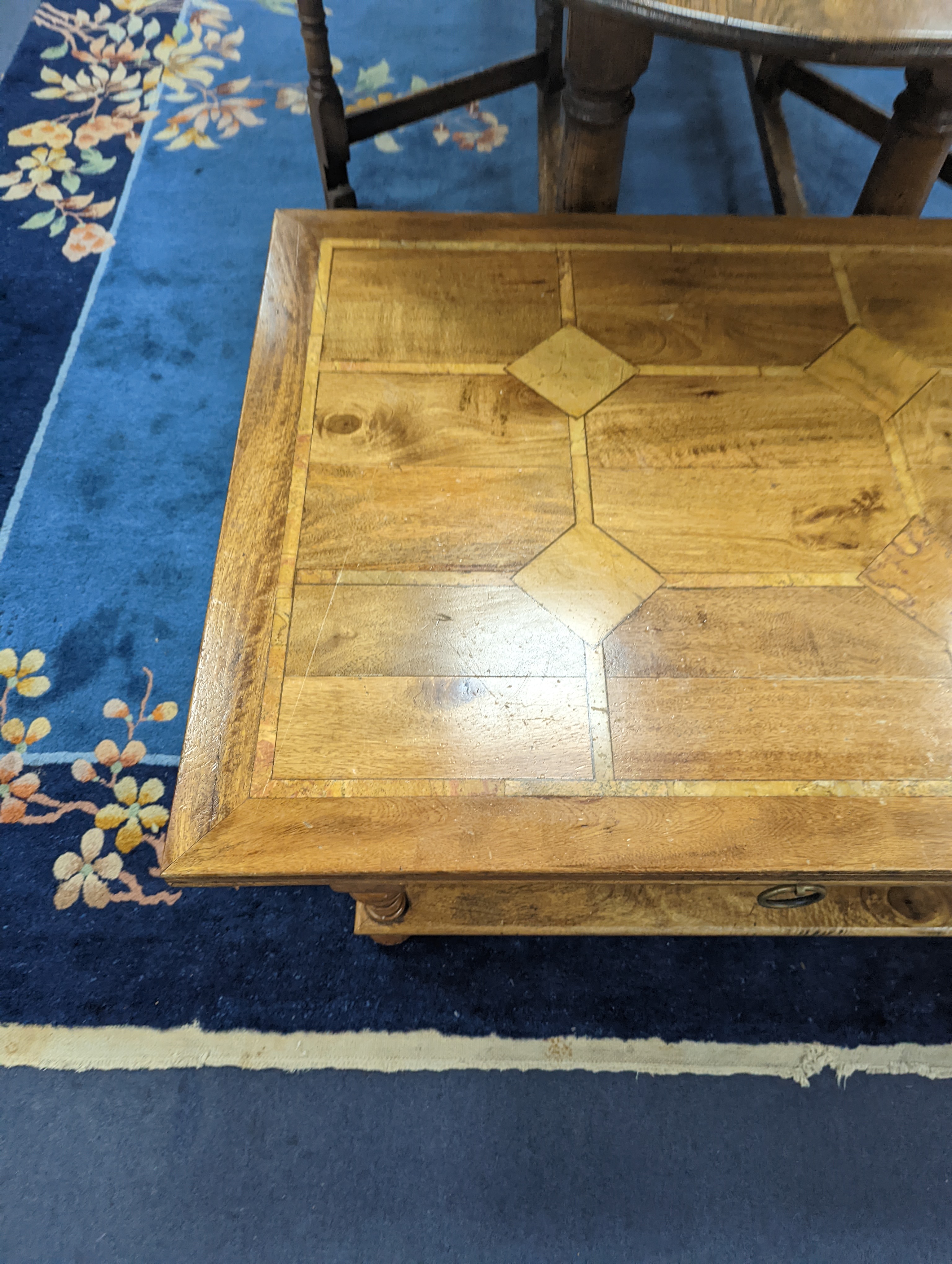 A hardwood and marble inset coffee table, length 130cm, depth 80cm, height 45cm - Image 2 of 7