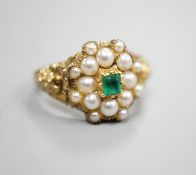 A Victorian style yellow metal, emerald and split pearl cluster set dress ring, size M, gross weight