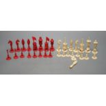 A North European stained ivory chess set, Kings 8cm