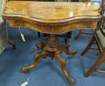 A Victorian figured walnut serpentine folding card table, width 92cm, depth 45cm, height 73cm