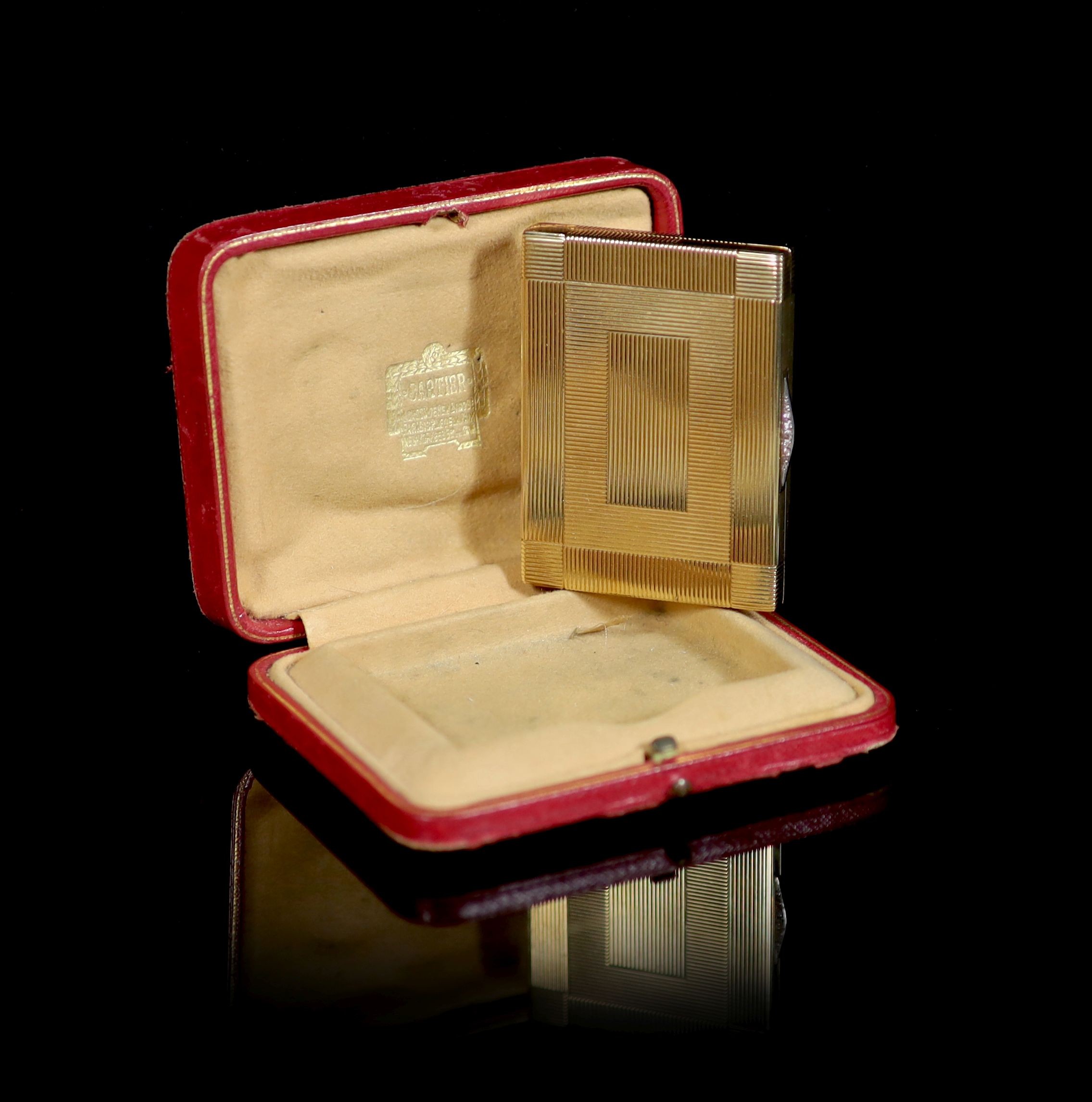 A 1930's Cartier 9ct gold compact, with diamond set thumbpiece,with reeded decoration and handled - Image 2 of 8