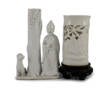 A Chinese blanc-de-chine figural joss stick holder and a similar brushpot, Dehua kilns, 18th/19th
