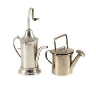 A George V silver novelty atomiser modelled as a pouring vessel, London, 1914, 12.3cm and a