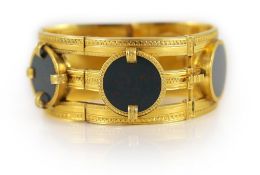 A 19th century French 18ct gold and five stone circular bloodstone set open work hinged bracelet,