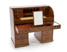 A George III mahogany cylinder top combined writing and dressing kneehole desk,with tambour