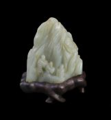 A Chinese pale celadon jade ‘Sanqing’ boulder carving, 18th century,carved in high relief with the