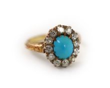 A late Victorian 18ct gold, turquoise and diamond set oval cluster ring,size N, gross weight 4.4