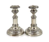 A pair of George III silver telescopic candlesticks, by S.C. Younge & Co,with gadrooned and scroll
