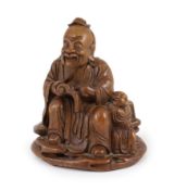 A Chinese carved bamboo figure of a seated sage reading a book, a boy beside him, probably 19th