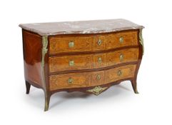 A late 18th century French banded kingwood serpentine marble top commode,with gilt metal mounts,